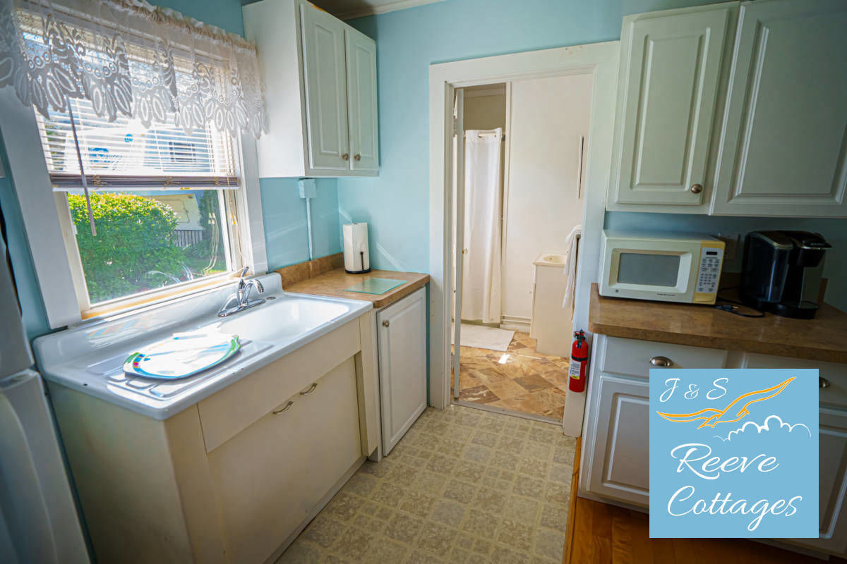 Cozy Waterfront Cottage 6 looking through main entrance showing kitchen and bathroom