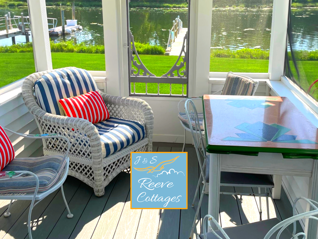 Premier Waterfront Cottage 3 Screened-In Porch on a sunny day viewing the water of Reeves Creek